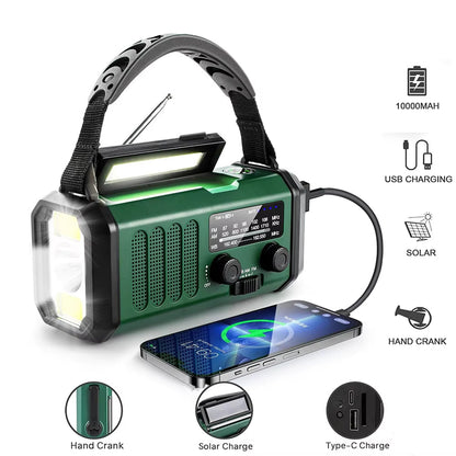 Green emergency crankoax radio  with flashlight and phone charger on a white background
