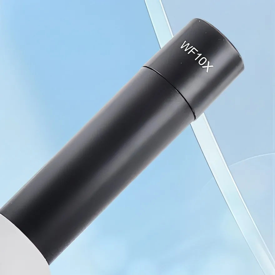 Black handheld magnifier with 'WF10X' label on a light blue background