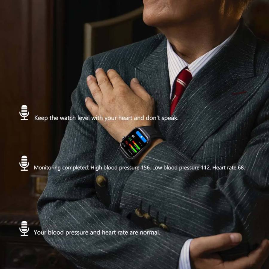 Man wearing a Noxus Blood Pressure Smartwatch with health monitoring display, sitting indoors.