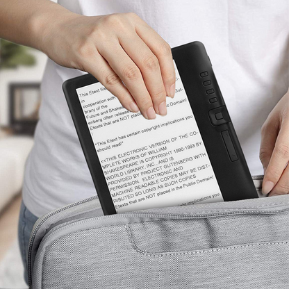 Person holding a Klarity Portable Ebook Readers with text displayed, sitting on a couch.