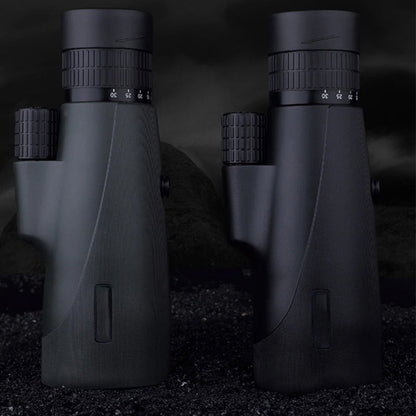 Two black SoceScope Monocular on a dark background