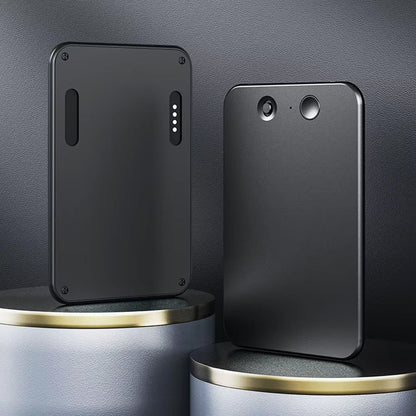 Two black phone cases on a metallic surface with a dark gray background