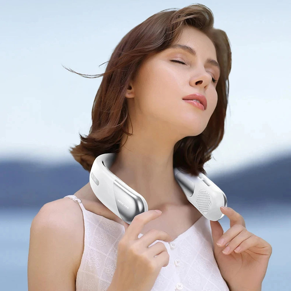 Woman wearing a white AuraIcyy Neck Fan against a blurred natural background